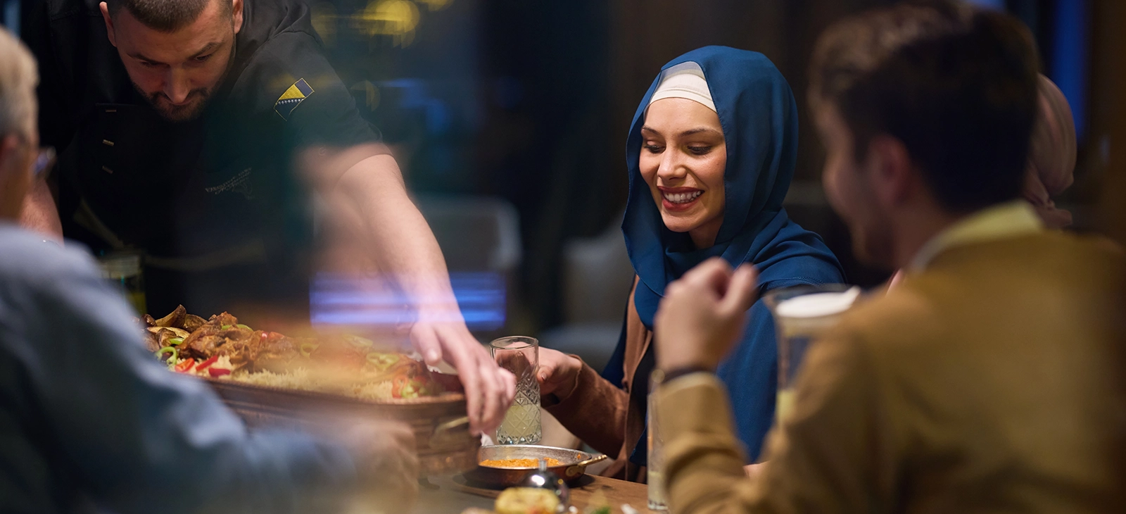 Friends enjoying dinner at a restaurant
