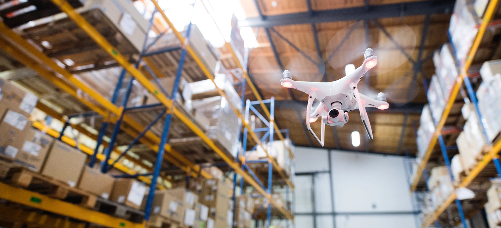 Drone flying in the warehouse for inventory management



